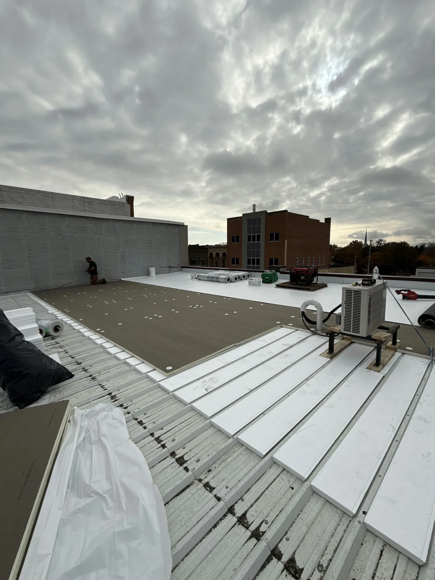Insulation and TPO over existing metal roof