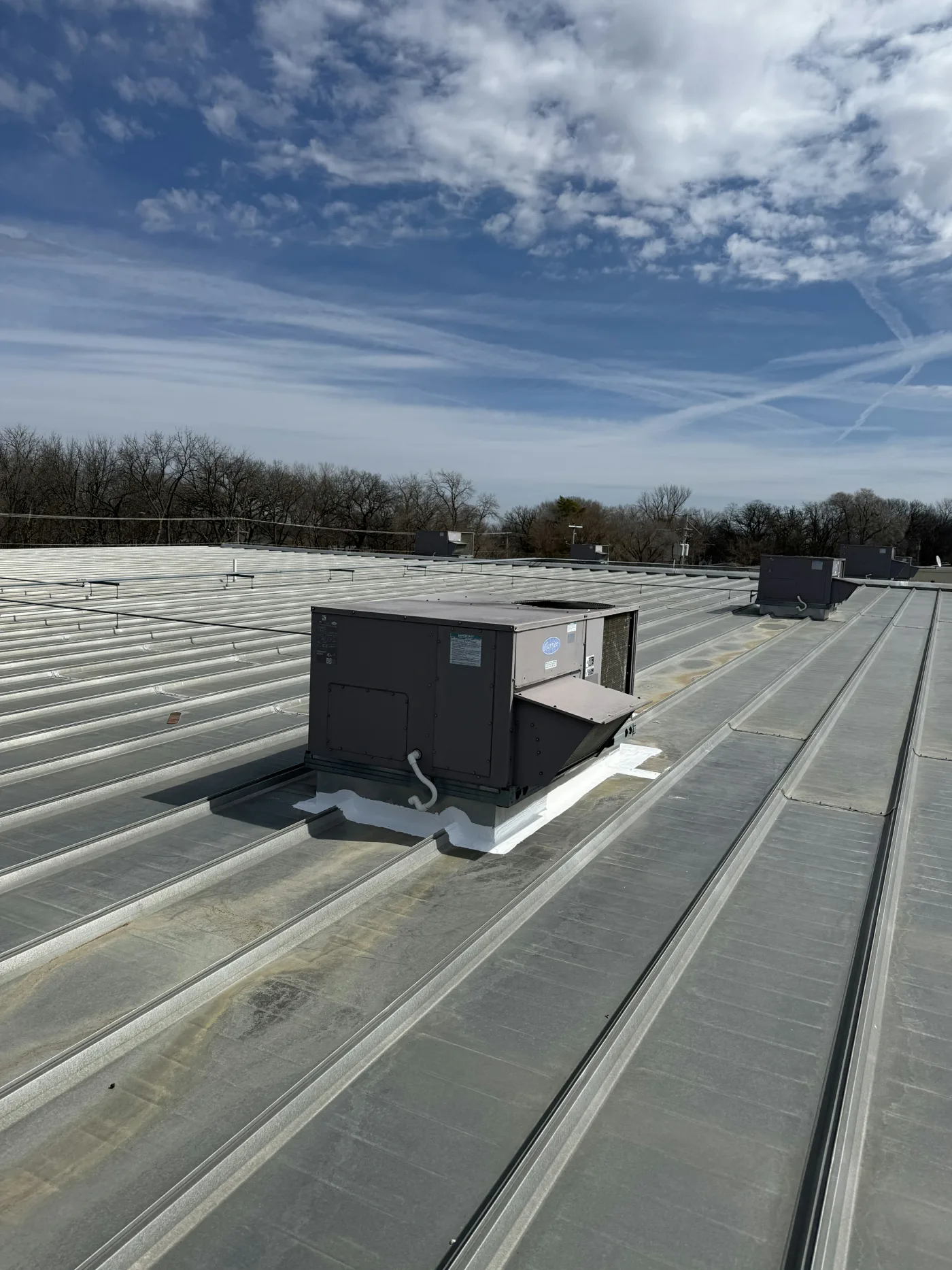Sealing around AC unit on metal roof