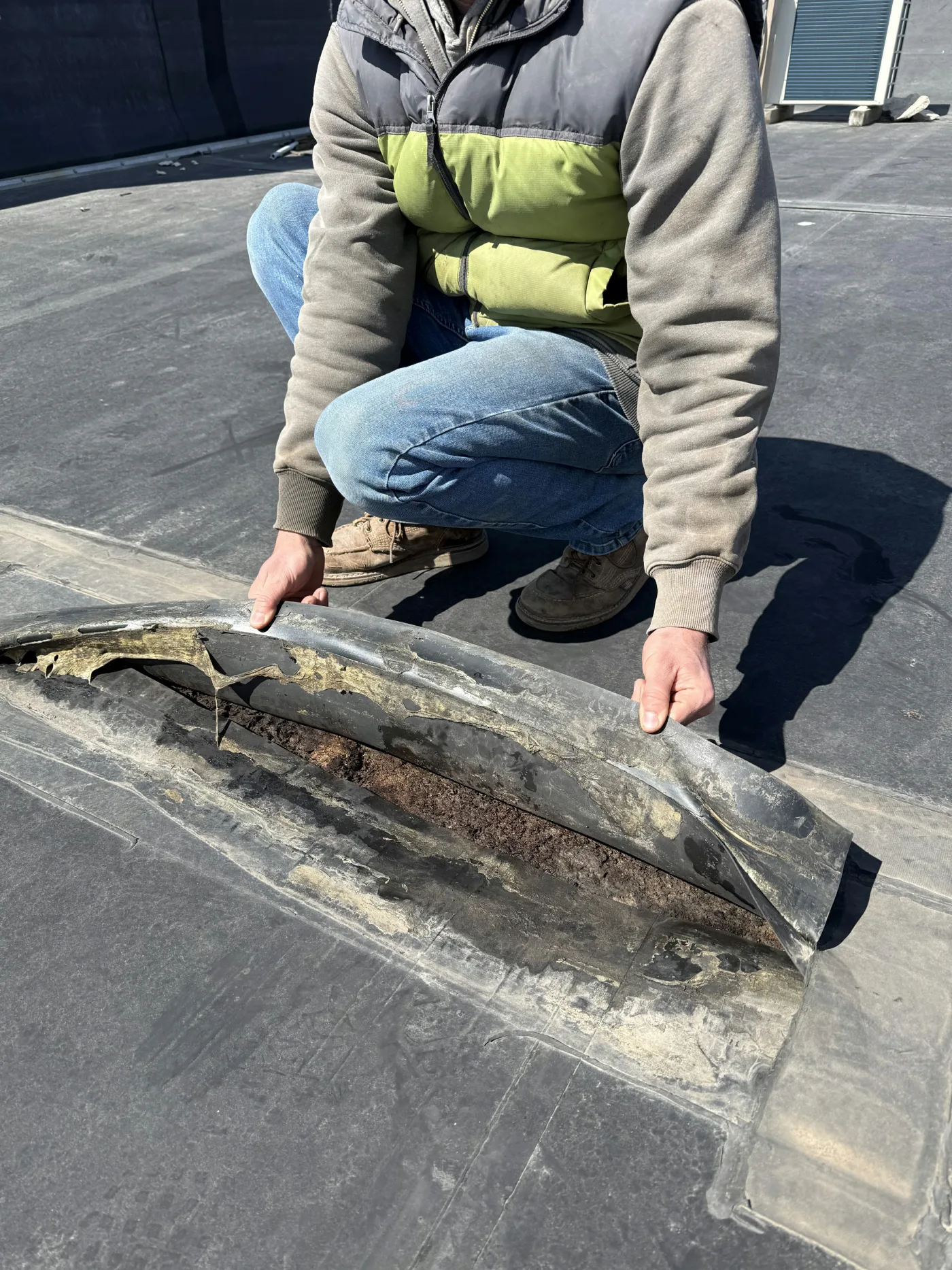 Seams coming apart in aged roofing membrane